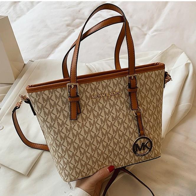 MK mini sling bag, Women's Fashion, Bags & Wallets, Cross-body Bags on  Carousell