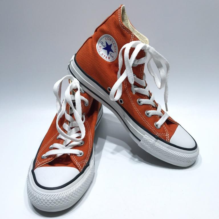 Orange high hotsell top converse