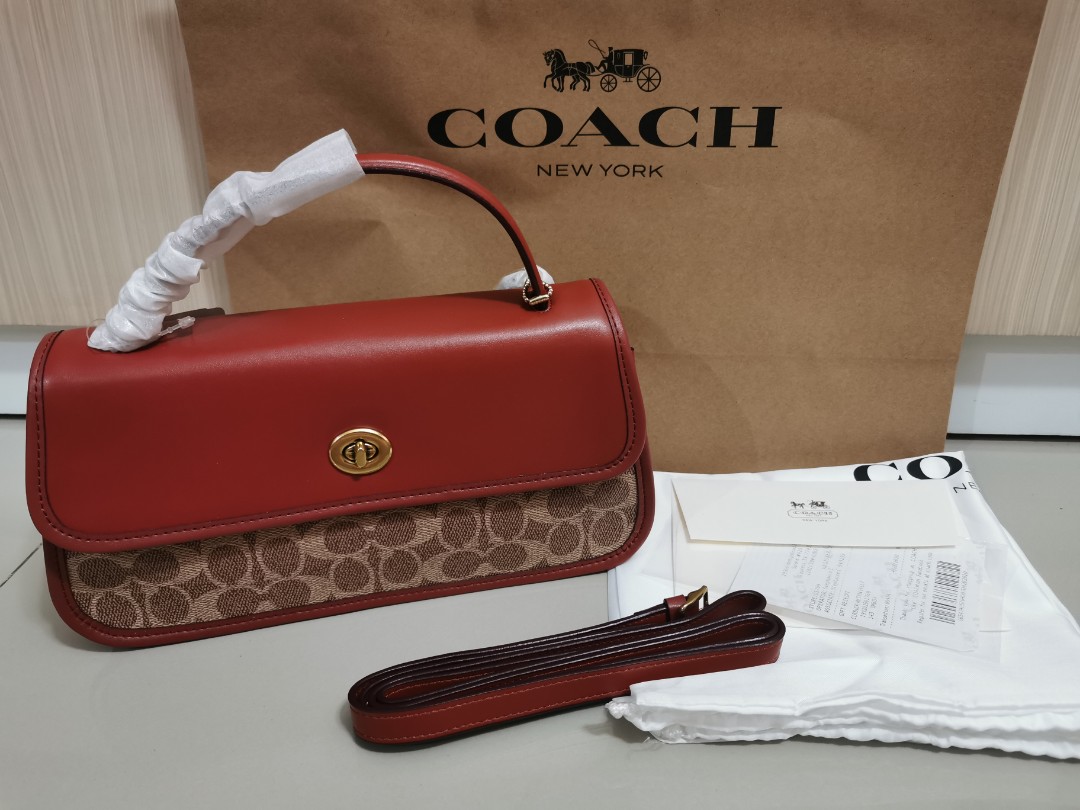 Turnlock clutch in signature discount canvas