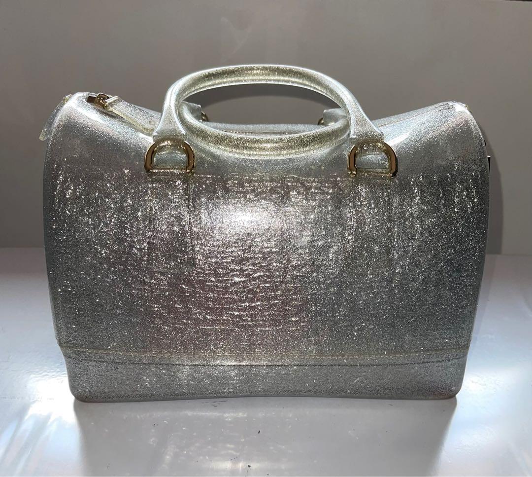 ❤️ Furla authentic sparkling siver jelly (Category: Luxury Bags & Wallets) located in Quezon City. Submitted by msgqmom (Listing ID 1130764161, Image 1). Description: With padlock & cards Please check the flaw at the end of the zipper & 2 dots of red ballpen Dust bag .