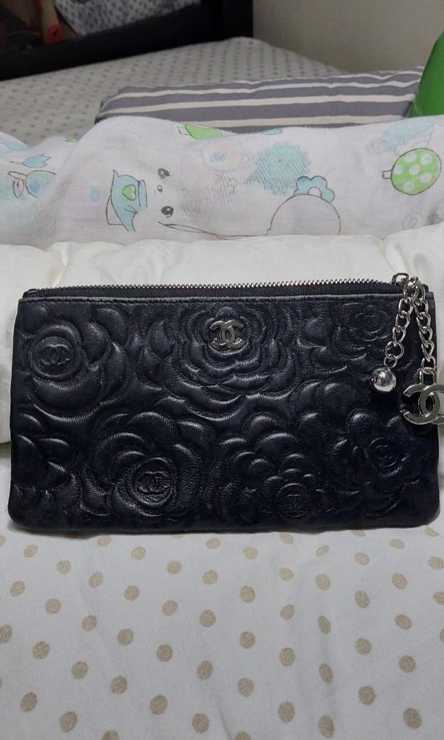 Chanel Camelia pouch (Category: Luxury Bags & Wallets) located in Baguio. Submitted by lotus_blossom (Listing ID 1130765994, Image 1). Description: Kindly see all posted pics slight fading on leather. JRS shipping.