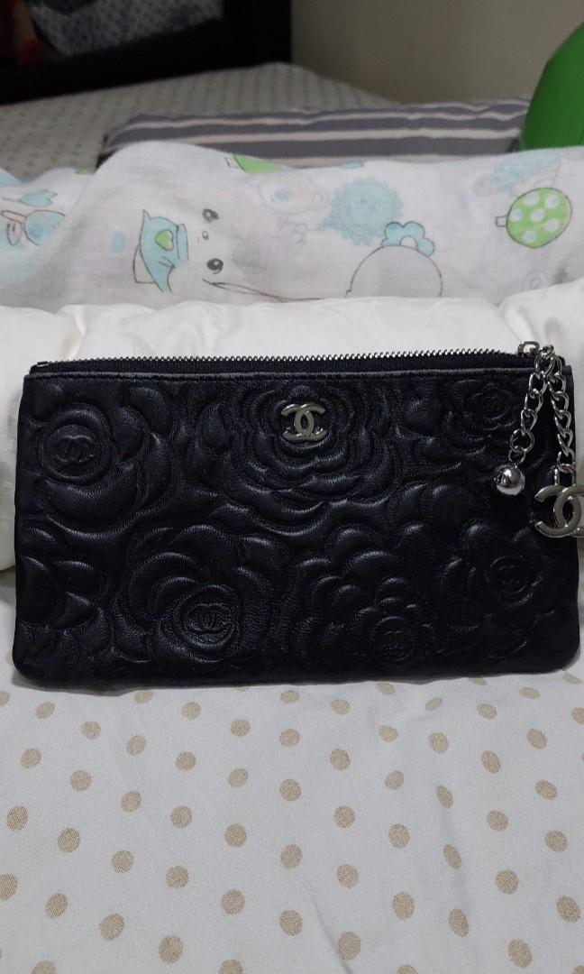 Chanel Camelia pouch (Category: Luxury Bags & Wallets) located in Baguio. Submitted by lotus_blossom (Listing ID 1130765994, Image 2). Description: Kindly see all posted pics slight fading on leather. JRS shipping.