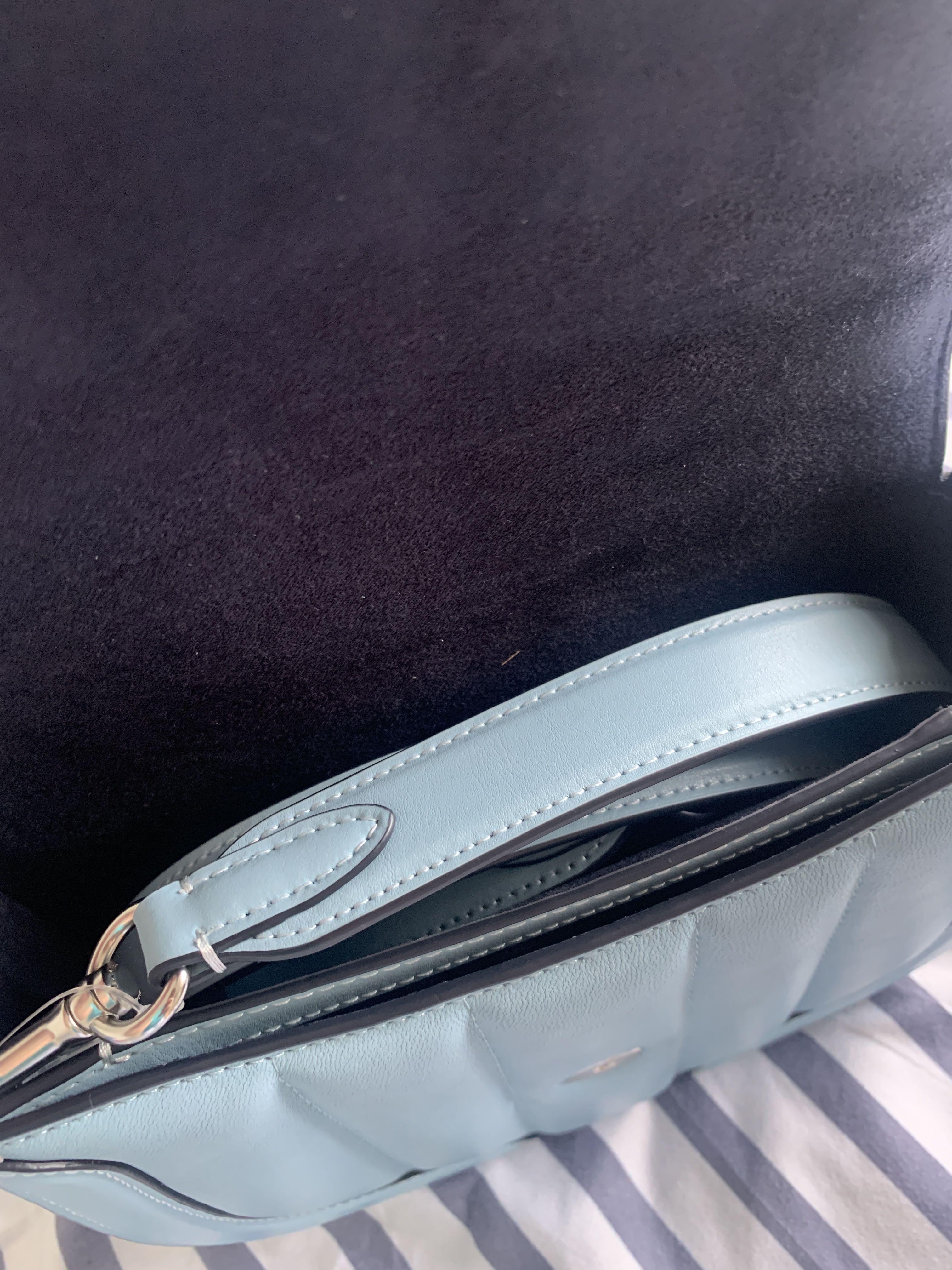 Coach Georgie Saddle Bag with Quilting (Category: Luxury Bags & Wallets) located in Calamba. Submitted by chaserstar (Listing ID 1130671551, Image 3). Description: RARE COLOR Coach Georgie Saddle Bag with Quilting in Waterfall color and silver hardware Bought from Canada Brand new and unused Nappa leather and smooth leather Inside multifunction pockets Snap closure, fabric lining Outside open pocket Detachable strap with 20 3/4" drop for shoulder