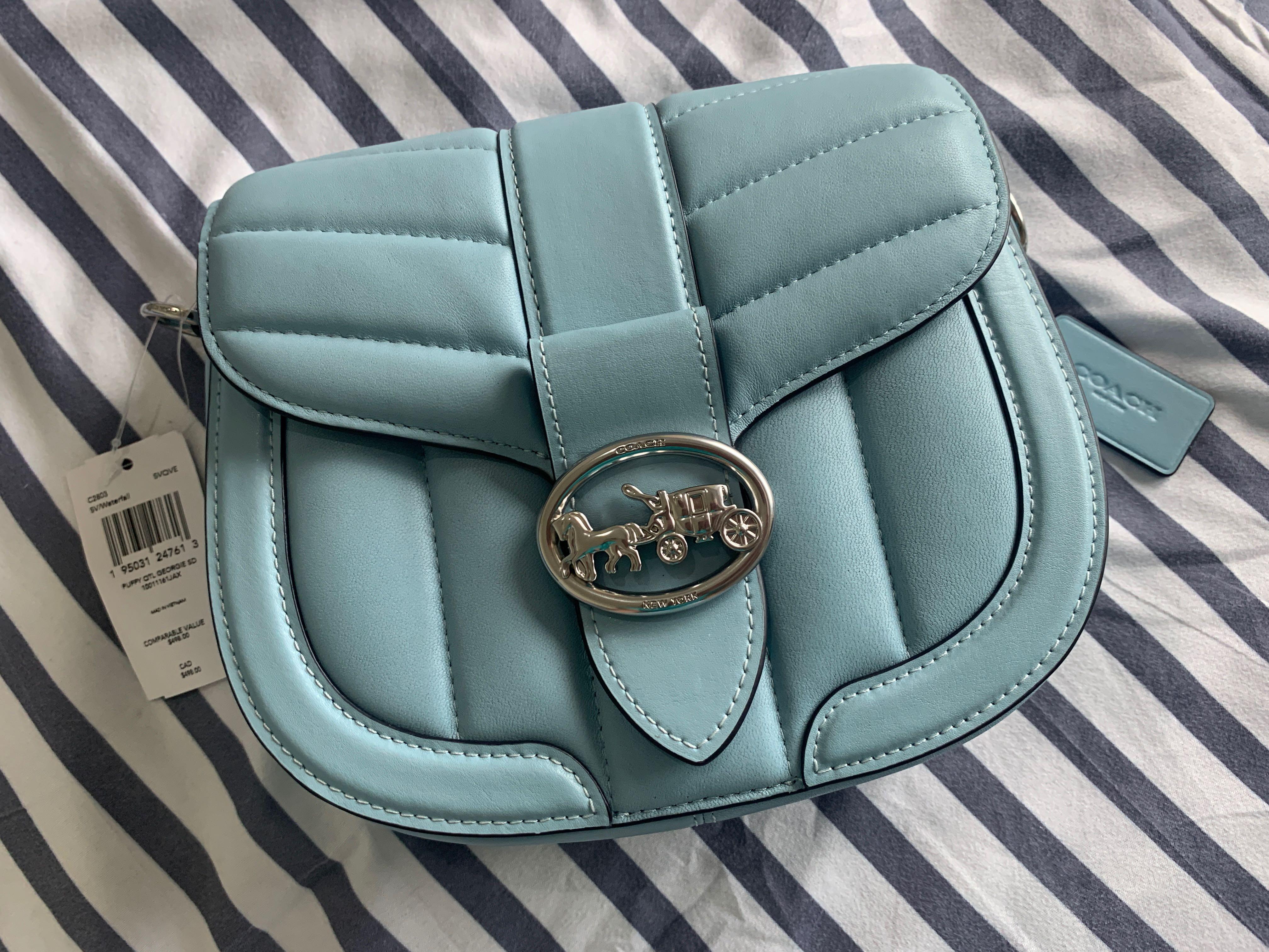 Coach Georgie Saddle Bag with Quilting (Category: Luxury Bags & Wallets) located in Calamba. Submitted by chaserstar (Listing ID 1130671551, Image 1). Description: RARE COLOR Coach Georgie Saddle Bag with Quilting in Waterfall color and silver hardware Bought from Canada Brand new and unused Nappa leather and smooth leather Inside multifunction pockets Snap closure, fabric lining Outside open pocket Detachable strap with 20 3/4" drop for shoulder