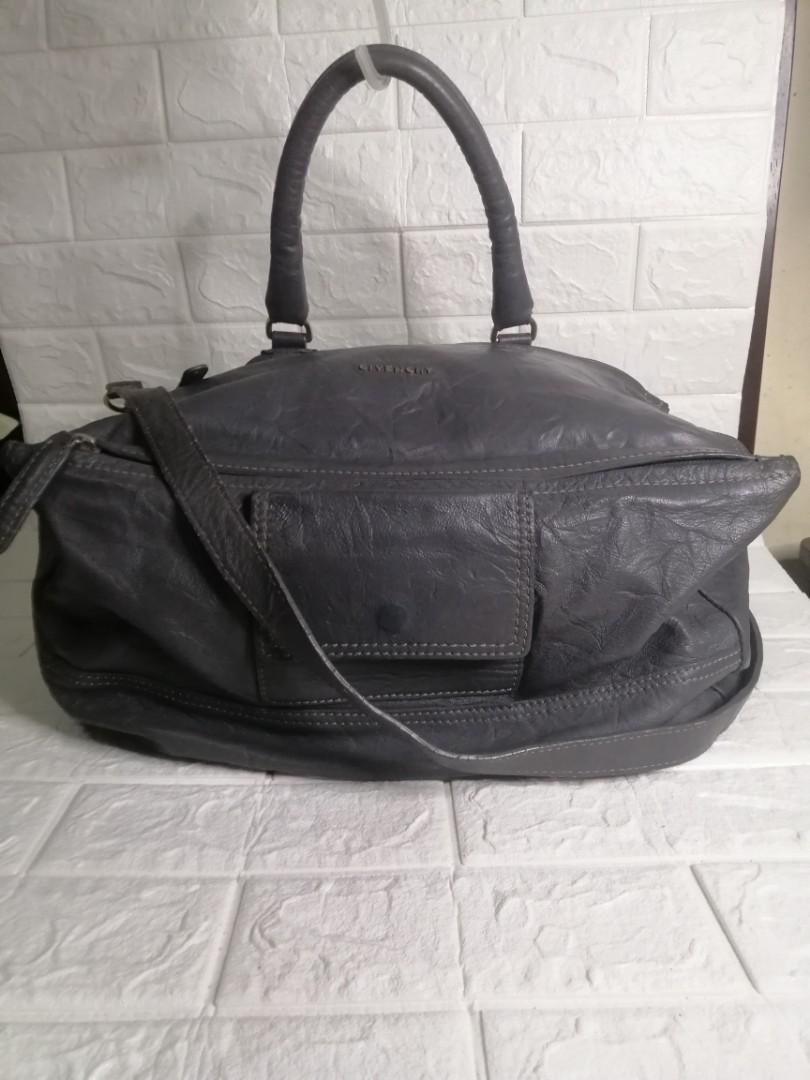 Givenchy Pandora Leather Large Bag (Category: Luxury Bags & Wallets) located in Las Pinas. Submitted by etoksi1234 (Listing ID 1130936689, Image 1). Description: Pre-loved Givenchy Pandora Leather Large bag... Lampu Zip... Silver tone hardware... With code inside the pocket... Some crackings on the leather.... Size: L-15" X H-10" x D-7" Please manage your expectations. All sales are final. Kindly examine pictures carefully when buying online. No 