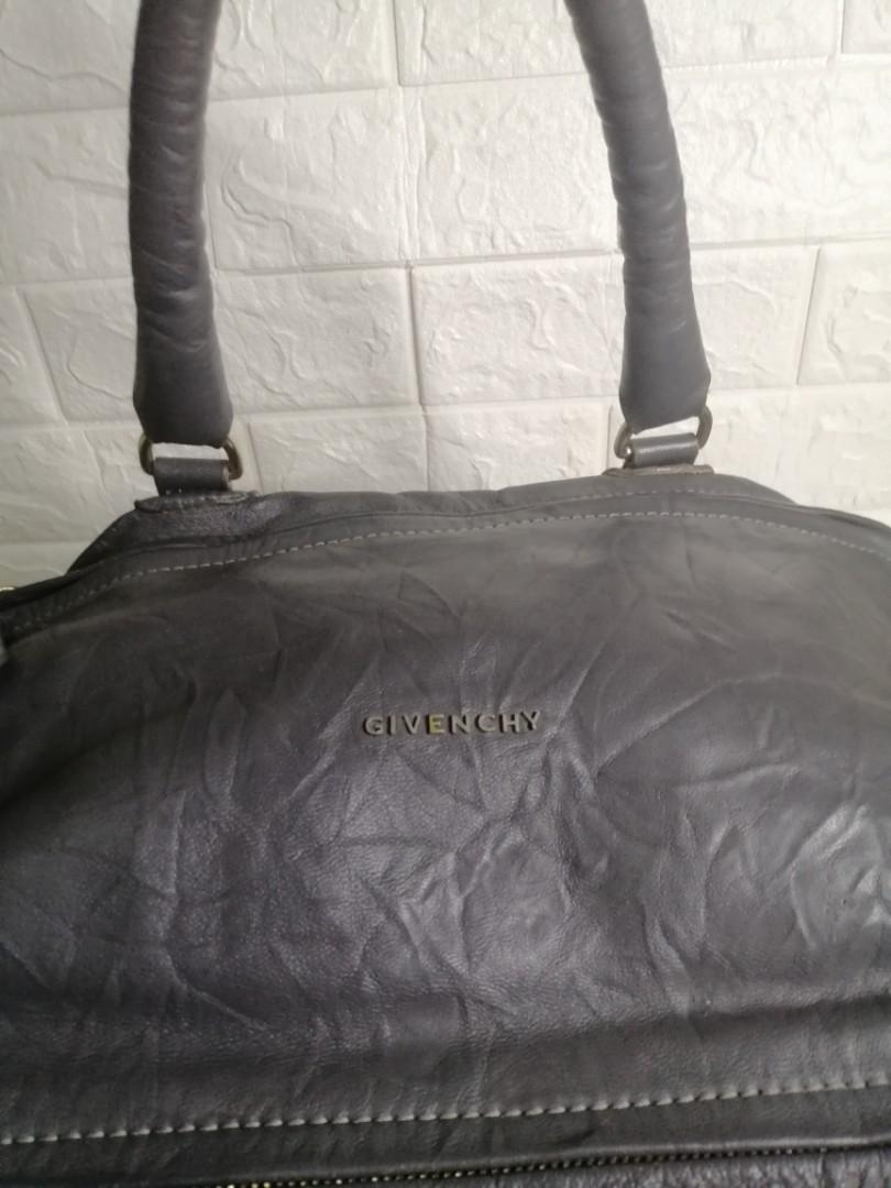 Givenchy Pandora Leather Large Bag (Category: Luxury Bags & Wallets) located in Las Pinas. Submitted by etoksi1234 (Listing ID 1130936689, Image 3). Description: Pre-loved Givenchy Pandora Leather Large bag... Lampu Zip... Silver tone hardware... With code inside the pocket... Some crackings on the leather.... Size: L-15" X H-10" x D-7" Please manage your expectations. All sales are final. Kindly examine pictures carefully when buying online. No 