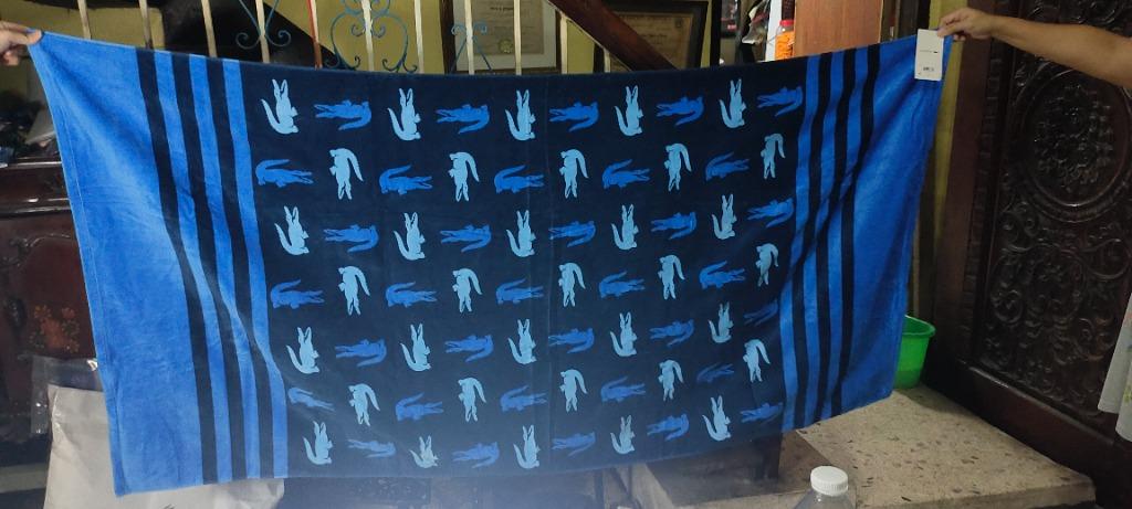 LACOSTE CHROMA COTTON STRIPE BEACH TOWEL (Category: Bedding & Towels) located in Malabon City. Submitted by gie_silva (Listing ID 1131017206, Image 1). Description: Stay comfortable and dry in style with the help of this Chroma beach towel, featuring super-absorbent cotton terry cloth and a fun pattern of Lacoste's signature croc logos. Dimensions: 36" x 72" Soft cotton velvet on the face, absorbent terry cloth on the reverse Each towel sold indi