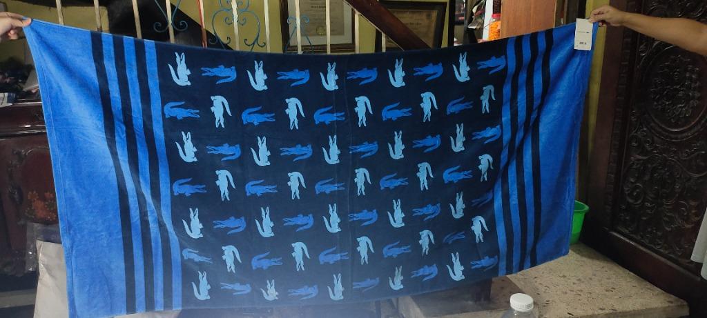 LACOSTE CHROMA COTTON STRIPE BEACH TOWEL (Category: Bedding & Towels) located in Malabon City. Submitted by gie_silva (Listing ID 1131017206, Image 3). Description: Stay comfortable and dry in style with the help of this Chroma beach towel, featuring super-absorbent cotton terry cloth and a fun pattern of Lacoste's signature croc logos. Dimensions: 36" x 72" Soft cotton velvet on the face, absorbent terry cloth on the reverse Each towel sold indi