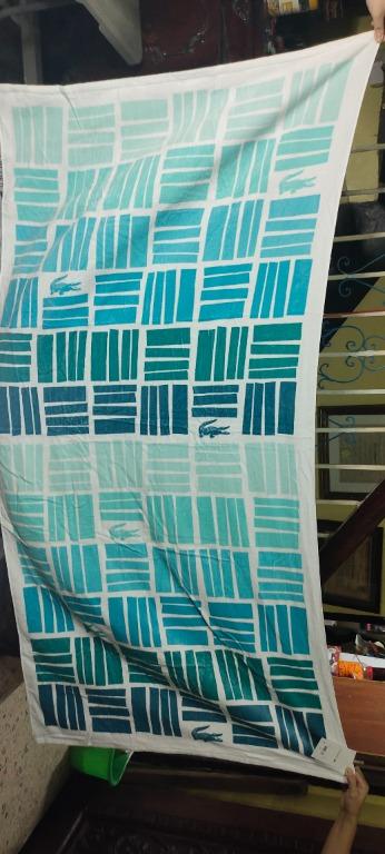 LACOSTE GRADIENT GEOMETRIC COTTON BEACH TOWEL (Category: Bedding & Towels) located in Malabon City. Submitted by gie_silva (Listing ID 1131015315, Image 2). Description: BRAND NEW ON HAND ITEM SAME DAY DELIVERY Stay comfortable and stylish while you soak up some sun with the help of this super-soft cotton beach towel from Lacoste, featuring a gradient geometric pattern with croc logo accents and an absorbent terry cloth reverse. Dimensions: 36" x