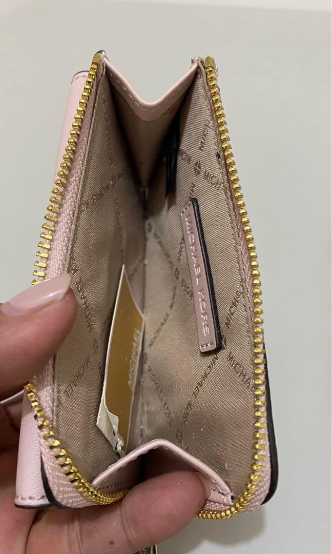 Card holder with coin zip clearance