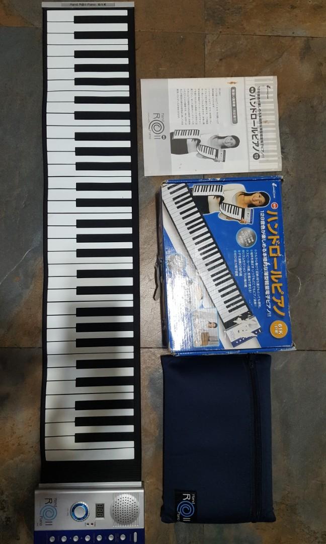 Piano Hand Roll 61 Keys (Category: Musical Instruments) located in Binangonan. Submitted by stufflikedat (Listing ID 1130923818, Image 3). Description: Ginza Yamano Music (Japan) hand roll piano 61 keys, 128 tones,100 rhythm,20 demo tunes, all keys are functioning, complete with power adaptor 110V, manual in japanese & english, carry bag and box. can be rolled & can be played using AA batteries.like new condition for 2.8k.