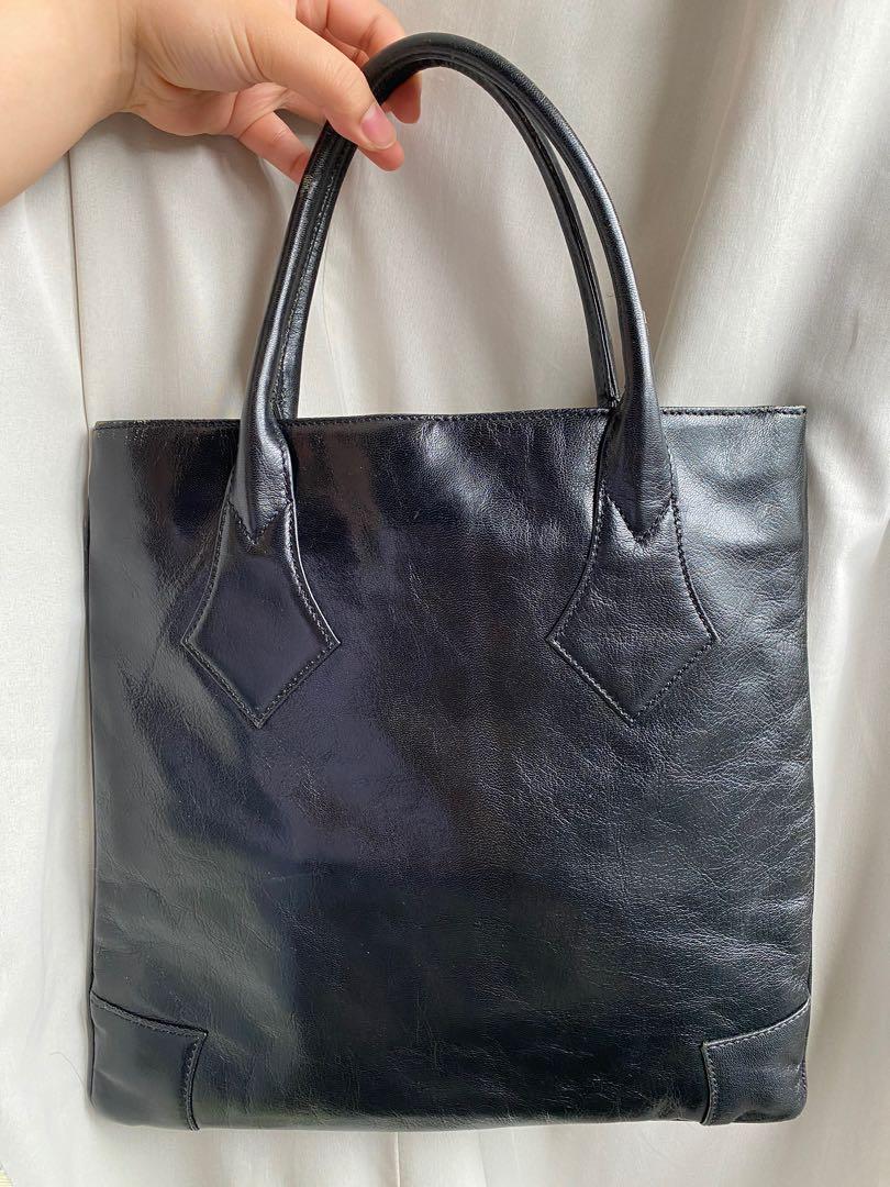 Authentic Vivienne Westwood Handbag/Mini Tote (Category: Luxury Bags & Wallets) located in Quezon City. Submitted by pineapplecakes (Listing ID 1131088330, Image 2). Description: AUTHENTIC vivienne westwood genuine leather all black handbag. bought from a well-trusted vintage store on instagram for 2,500+shipping (swipe for screenshot!) has minor signs of wear present, but those were present ever since i got it. rfs: no longer using it, declutter