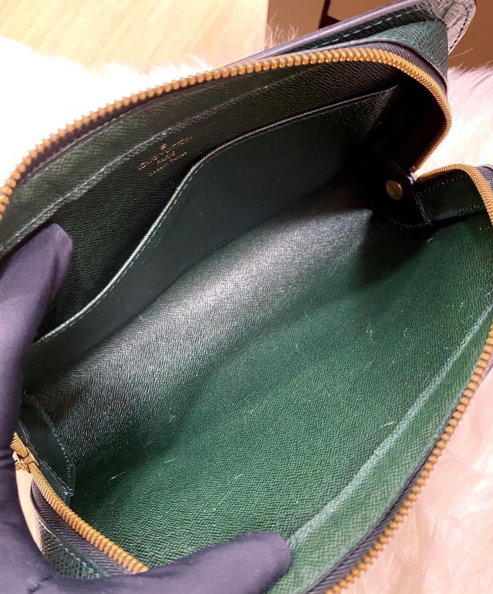 L V Epicea Taiga Leather Pochette Baikal Clutch, Luxury, Bags & Wallets on  Carousell
