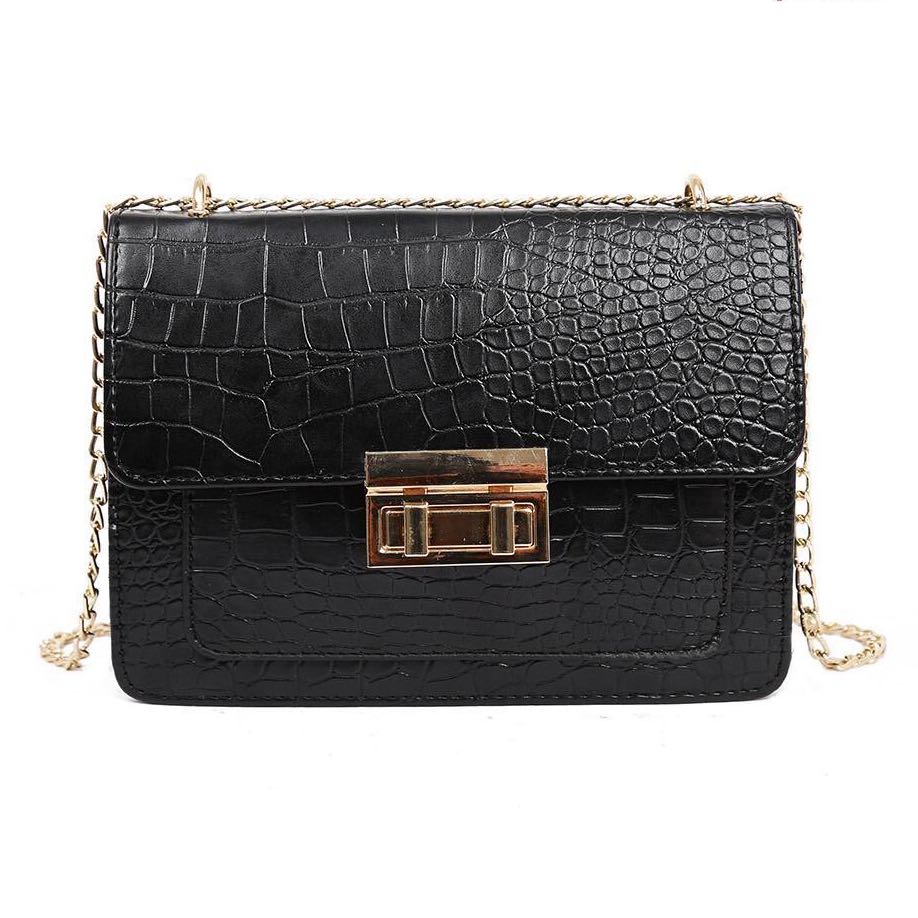 Sling bag with crocodile pattern