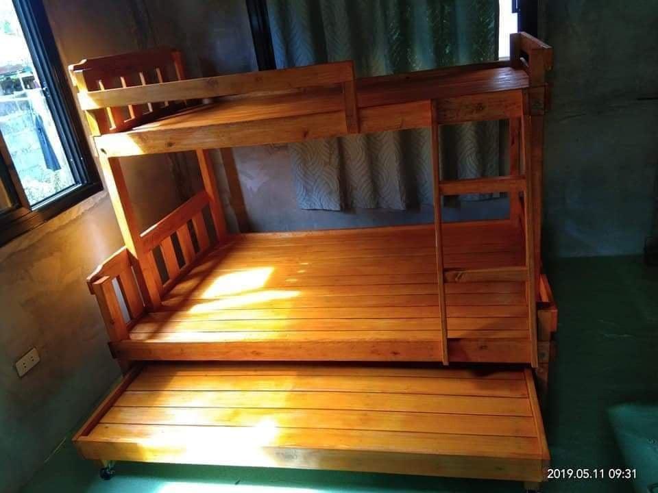 Wooden Double Deck with pullout bed 09498310053 (Category: Bed Frames & Mattresses) located in Quezon City. Submitted by leocarloswoodcrafts (Listing ID 1131156063, Image 1). Description: made from solid mahogany wood. FOAM NOT INCLUDED. Price may change depending on size, design, wood type use, varnish and/or color. We also accept made to order and customized wooden Furnitures Standard bed sizes: (in inches) 36x75 single size top bed 48x75 doubl