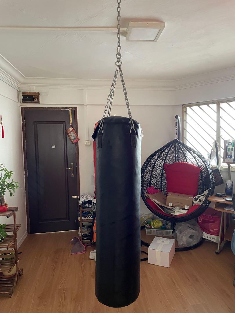 Studio Shot Of A Red Punching Bag Hanging Stock Photo - Download Image Now  - Punching Bag, White Background, Boxing - Sport - iStock