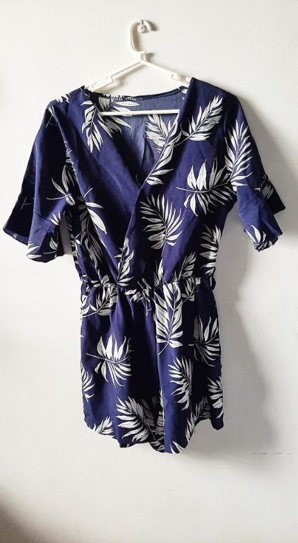 Navy Blue Romper White Leaves Floral Pattern (Category: Rompers) located in Makati City. Submitted by cqmpreloved (Listing ID 1131510897, Image 2). Description: Short romper in navy blue with leaves and floral pattern. Preloved. Rarely used. Bought from Ayala Malls Feliz best as casual outfit Freesize Perfectly fits XS-L Basic, Boho, Korean, Sexy, Street Style Summer Short Sleeves NOTE Item is preloved meaning it is used once and not brand new. A