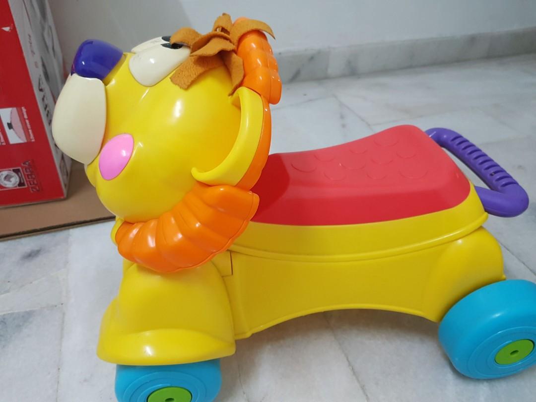 Trotteur lion 2024 fisher price prix