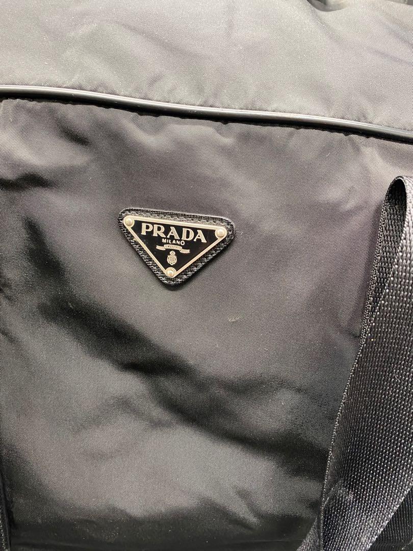 PRADA traveling bag (RARE) (Category: Luxury Bags & Wallets) located in Manila. Submitted by davidspreowned (Listing ID 1131773580, Image 2). Description: Prada traveling bag black no flaws 50.5 width 30.2 height 13 inches (clearance side to side) .