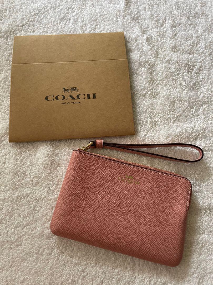 Light pink coach wristlet top