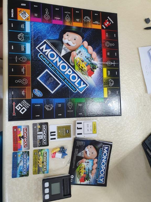  Hasbro Gaming Monopoly Super Electronic Banking Board Game,  Electronic Banking Unit, Choose Your Rewards, Cashless Gameplay Tap  Technology, for Ages 8 and Up : Toys & Games