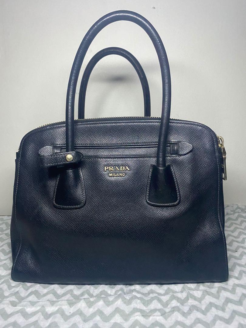 Prada double zip Saffiano Leather bag (Category: Luxury Bags & Wallets) located in Pasig City. Submitted by preloversph (Listing ID 1132516399, Image 1). Description: Authentic Missing sling Very good used condition.