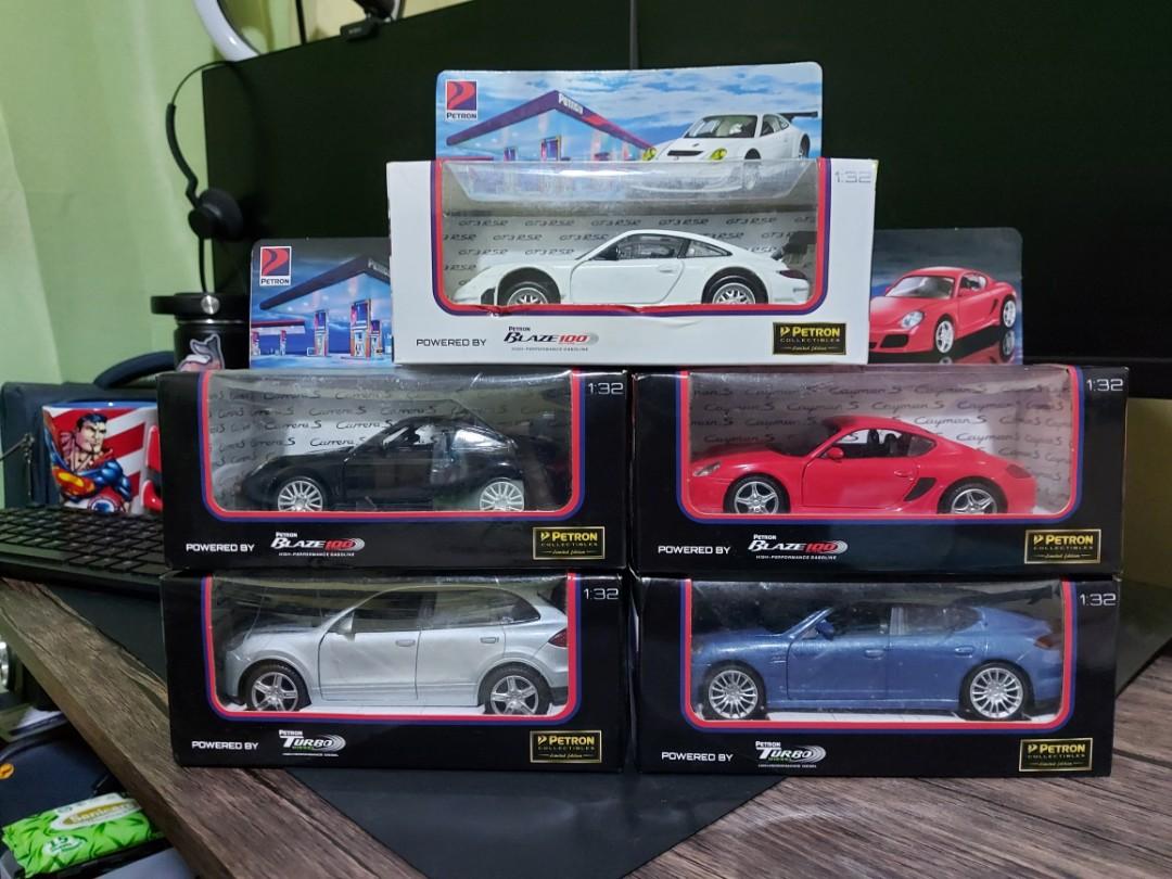Petron Cars (Category: Vehicle & Diecast Models) located in Manila. Submitted by naserrano (Listing ID 1129177596, Image 1). Description: Petron Car collectibles, Limited edition. 1500 for 5 cars 1:32 scale Cayman S(Red) & GT3 RSR (White) sealed. the rest opened once. shelf quality, box has some dents and Carrera S' (black) box is torn in the right opening PM if interested..