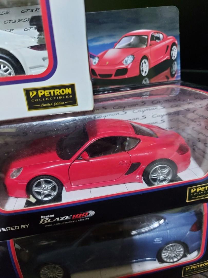 Petron Cars (Category: Vehicle & Diecast Models) located in Manila. Submitted by naserrano (Listing ID 1129177596, Image 2). Description: Petron Car collectibles, Limited edition. 1500 for 5 cars 1:32 scale Cayman S(Red) & GT3 RSR (White) sealed. the rest opened once. shelf quality, box has some dents and Carrera S' (black) box is torn in the right opening PM if interested..
