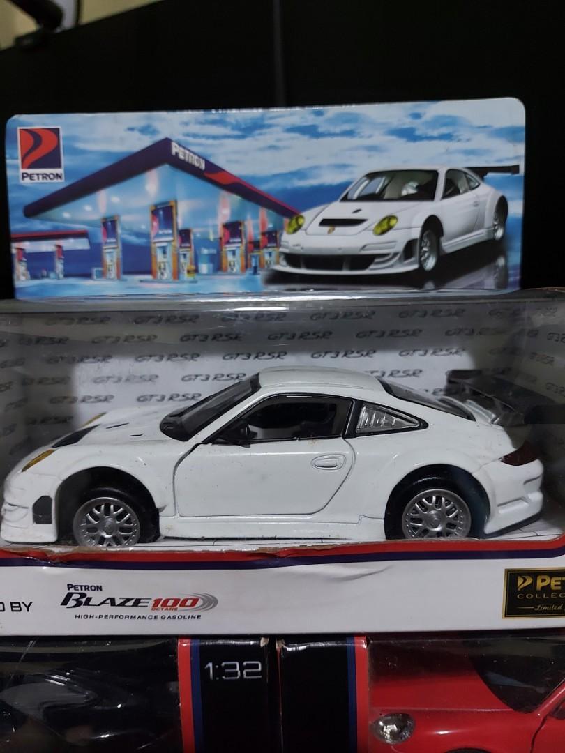 Petron Cars (Category: Vehicle & Diecast Models) located in Manila. Submitted by naserrano (Listing ID 1129177596, Image 3). Description: Petron Car collectibles, Limited edition. 1500 for 5 cars 1:32 scale Cayman S(Red) & GT3 RSR (White) sealed. the rest opened once. shelf quality, box has some dents and Carrera S' (black) box is torn in the right opening PM if interested..