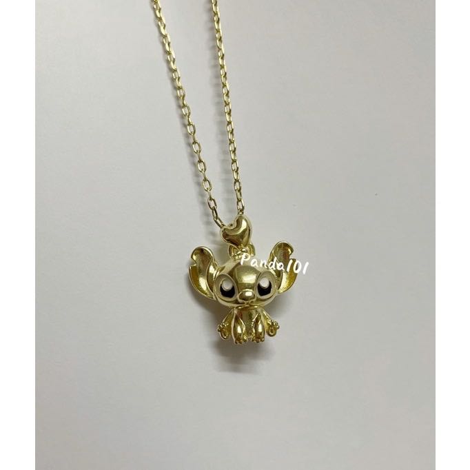 Stitch shop gold pendant