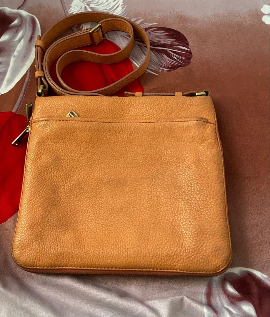 Fossil Preston Crossbody Bag (Category: Cross-body Bags) located in Concepcion. Submitted by shopdecluttereditems (Listing ID 1132574526, Image 2). Description: Fossil Preston Crossbody Bag 💯 Genuine Leather (soft) Melon color With signs of usage, faded hardware & scuffs on edges(see pics) Bought from Fossil Marquee Mall for 4k Dimensions: 9.5"L x 2.75"W x 8.25" Bag only, no other inclusions Mode of payment: Gcash, BDO or Security Bank Shipping: