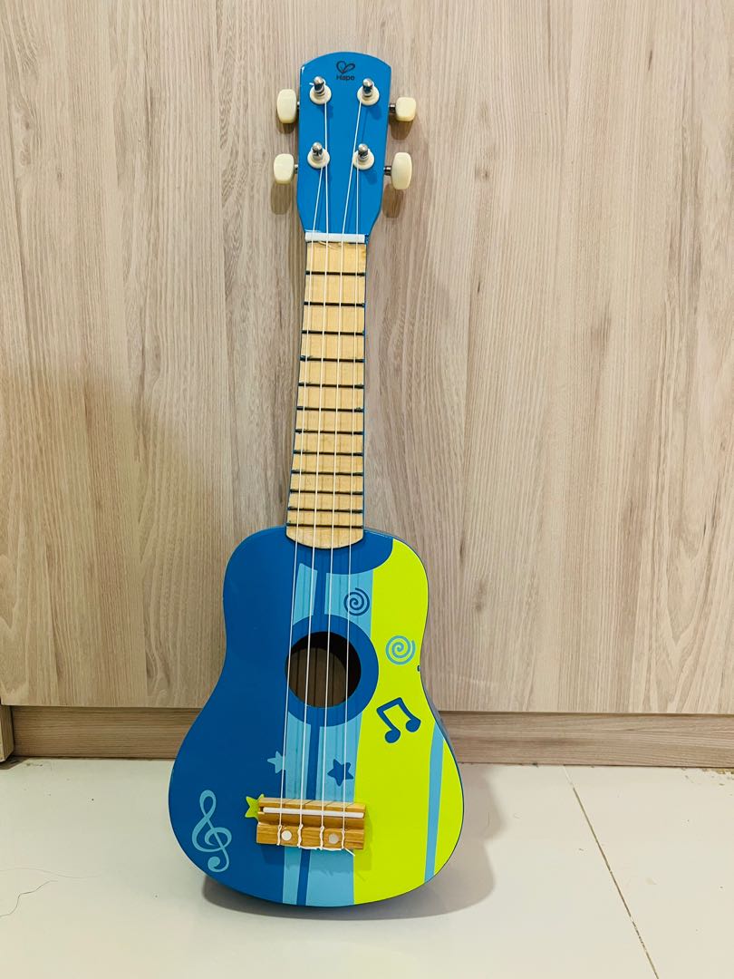 Hape kid's wooden toy ukulele in blue sales