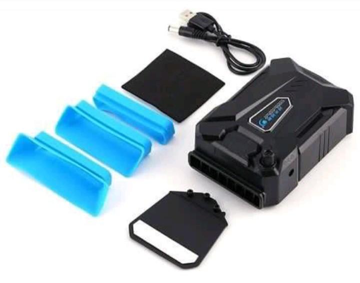 Portable laptop cooling fan (Category: Laptop Bags & Sleeves) located in Quezon City. Submitted by tinylittlecorner (Listing ID 1132788194, Image 3). Description: Mini cooling device that uses suction technology to reduce laptop heat by 3-5% while keeping silent complete with box and accessories.