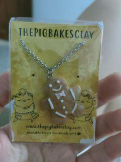 The Pig Bakes Clay Gingerbreadman necklace