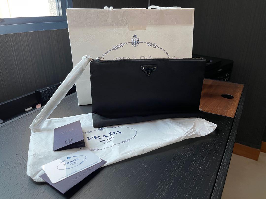 Prada logo plaque clutch bag online