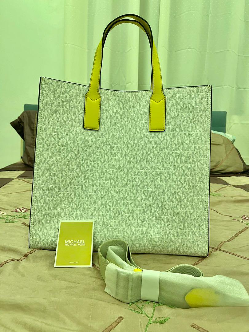 Michael Kors Kenly Tote Bag (Category: Luxury Bags & Wallets) located in Makati City. Submitted by saritsarishop (Listing ID 1133554909, Image 2). Description: Paunahan na lang mga sis!!! Michael Kors Kenly Tote Bag Citrus Multi Bought him the 🇺🇸 DETAILS • Tote bag • Logo-print canvas • 89.4% coated canvas/9.6% polyester/1% polyurethane • Gold-tone hardware • 14.25”W X 14”H X 5.5”D • Handle drop: 6” • Adjustable strap: 16”-25” • Exterior detail
