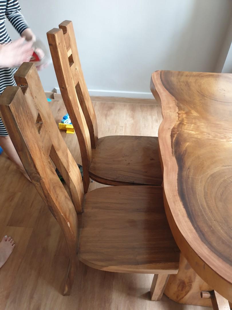 Solid wood Table set (Category: Tables & Sets) located in Singapore. Submitted by jn330 (Listing ID 1133470705, Image 2). Description: Solid wood table from joint tree trunks comes with 6 chairs- 3 sets of different chairs original price close to 3k The length is 131cm, width is 67cm, and height is 78cm. self collection only.