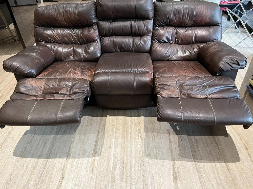 Heavily used reclining leather sofa for throw away price...reclining