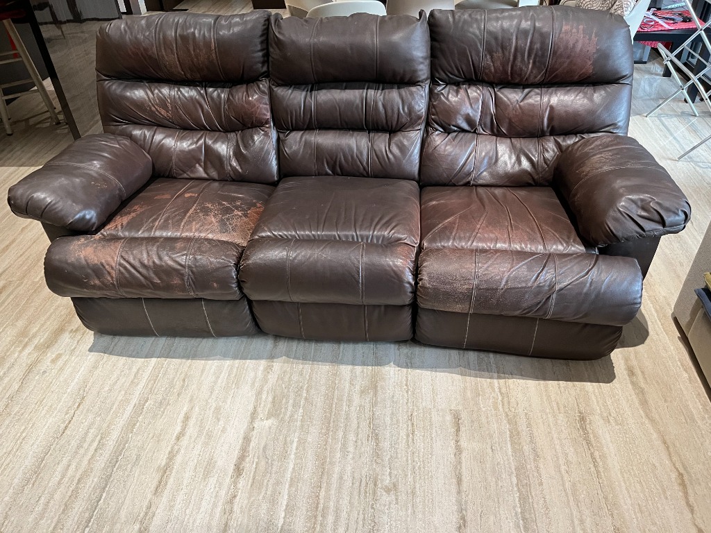 Heavily used reclining leather sofa for throw away price...reclining