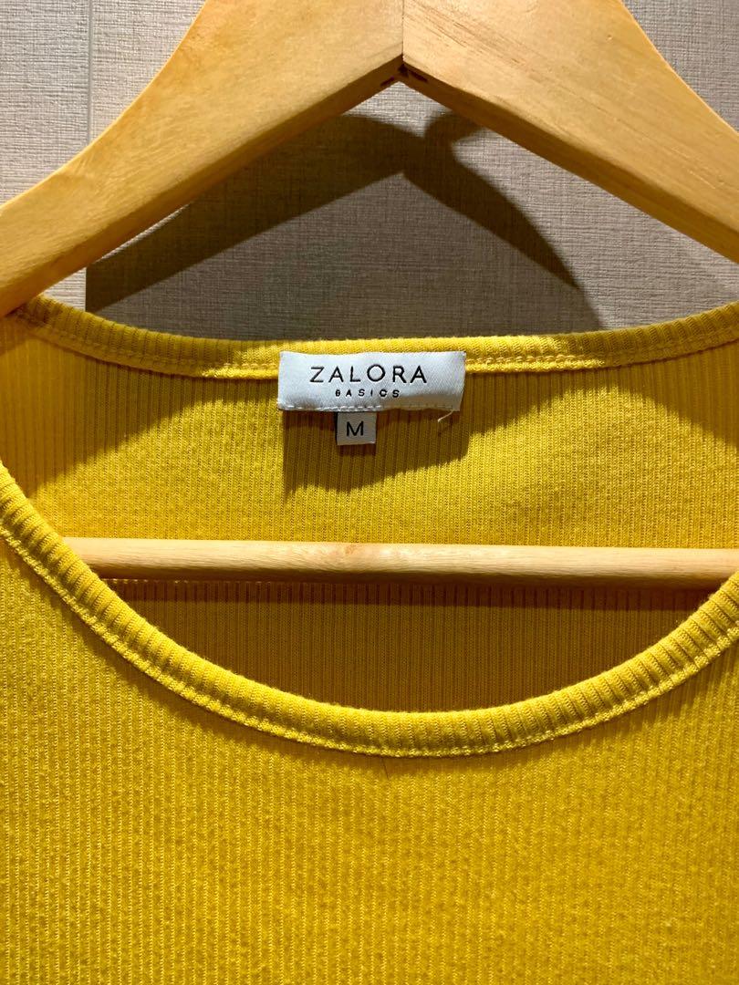 ZALORA Mustard Ribbed Shirt (Category: Sleeveless) located in Mandaluyong City. Submitted by declutterila (Listing ID 1133972354, Image 2). Description: Stretchy ribbed sleeveless shirt in mustard yellow. Super flattering and material is thick. Tag says medium but can fit a size small. Worn only twice. RFS: became a mom over the pandemic, doesn’t fit me anymore Shipping: fastrack / gogo express / lalamove / grab / shopee checkout.