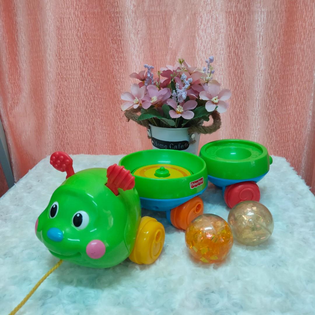 Fisher price top roll a rounds