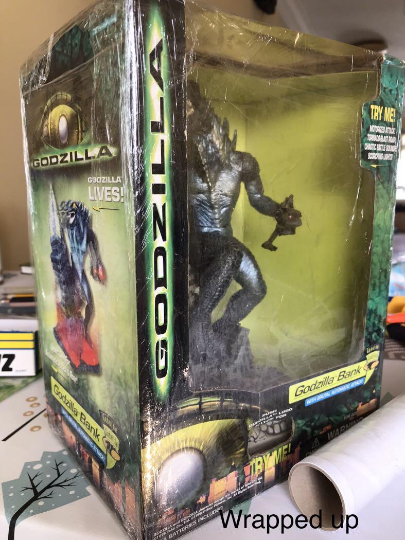 Godzilla Bank (electronics) (Category: Toy Figures) located in Singapore. Submitted by bsttm (Listing ID 1127375621, Image 8). Description: This is a kid coin box toy. It encourages saving. Com insertion triggers activation of Godzilla roars and screams. Nice additions to your collection as I am giving up this unique piece after several decades. By Trendmaster inc, 1998. Item no: 31128 Rare electronic toys.( box included) 1. vintage toy ; 1998. 2