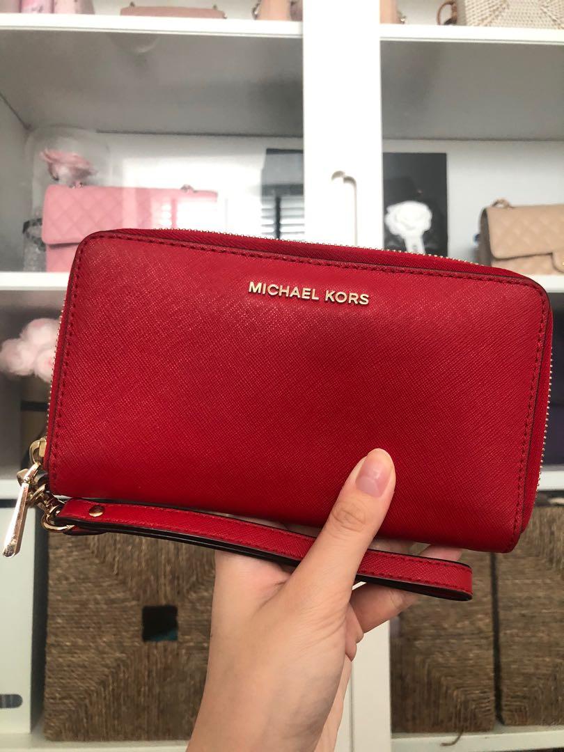 Michael Kors red long wallet /wristlet, Luxury, Bags & Wallets on Carousell