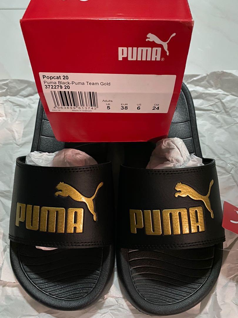 Puma slides black and gold top