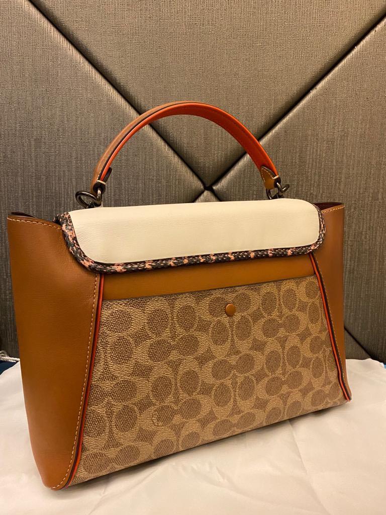 Coach courier carryall on sale with snakeskin detail