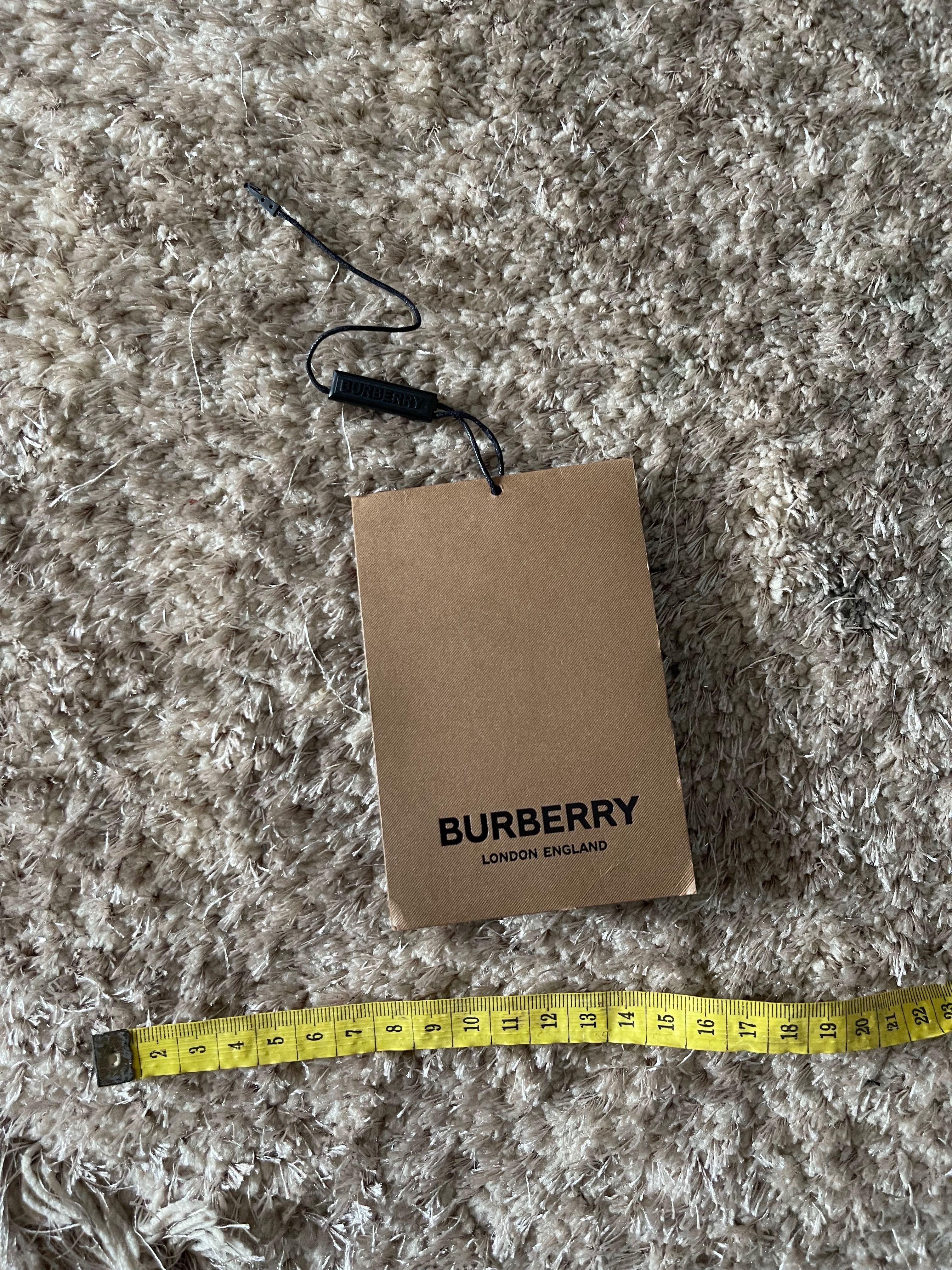 burberry label tag price tag like new authentic, Barang Mewah, Pakaian di  Carousell