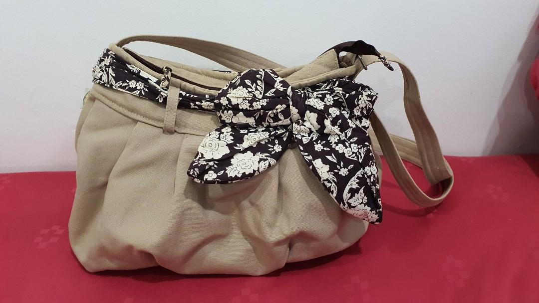 Naraya Ribbon sling bag beige colour Women s Fashion Bags Wallets Purses Pouches on Carousell