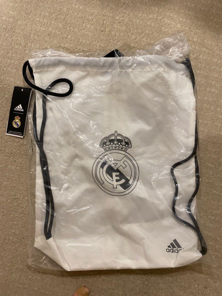Adidas Real Madrid Draw String Bag (Category: Sling Bags) located in Singapore. Submitted by pancaketato (Listing ID 1129838732, Image 2). Description: Authentic Adidas Real Madrid Drawstring Bag. In original packaging and tag still on.