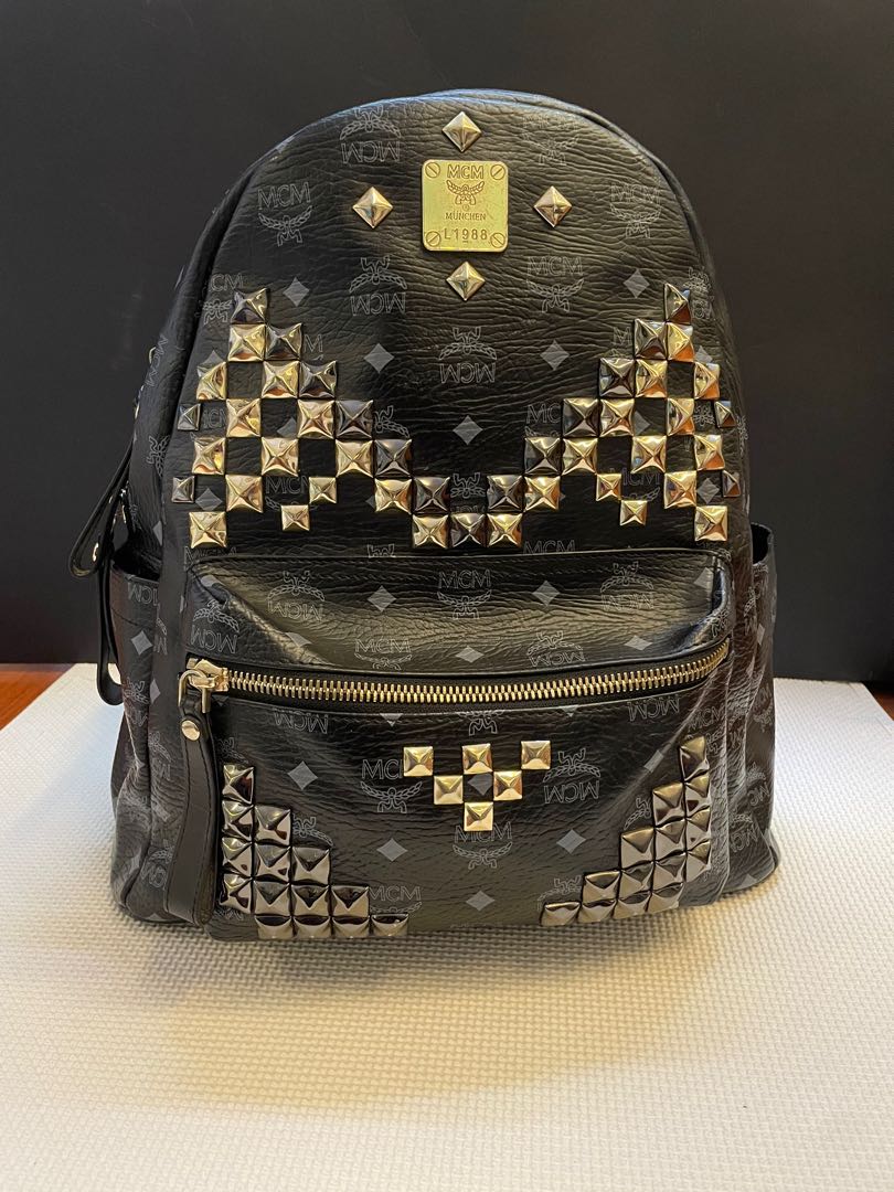 Black and outlet gold mcm backpack