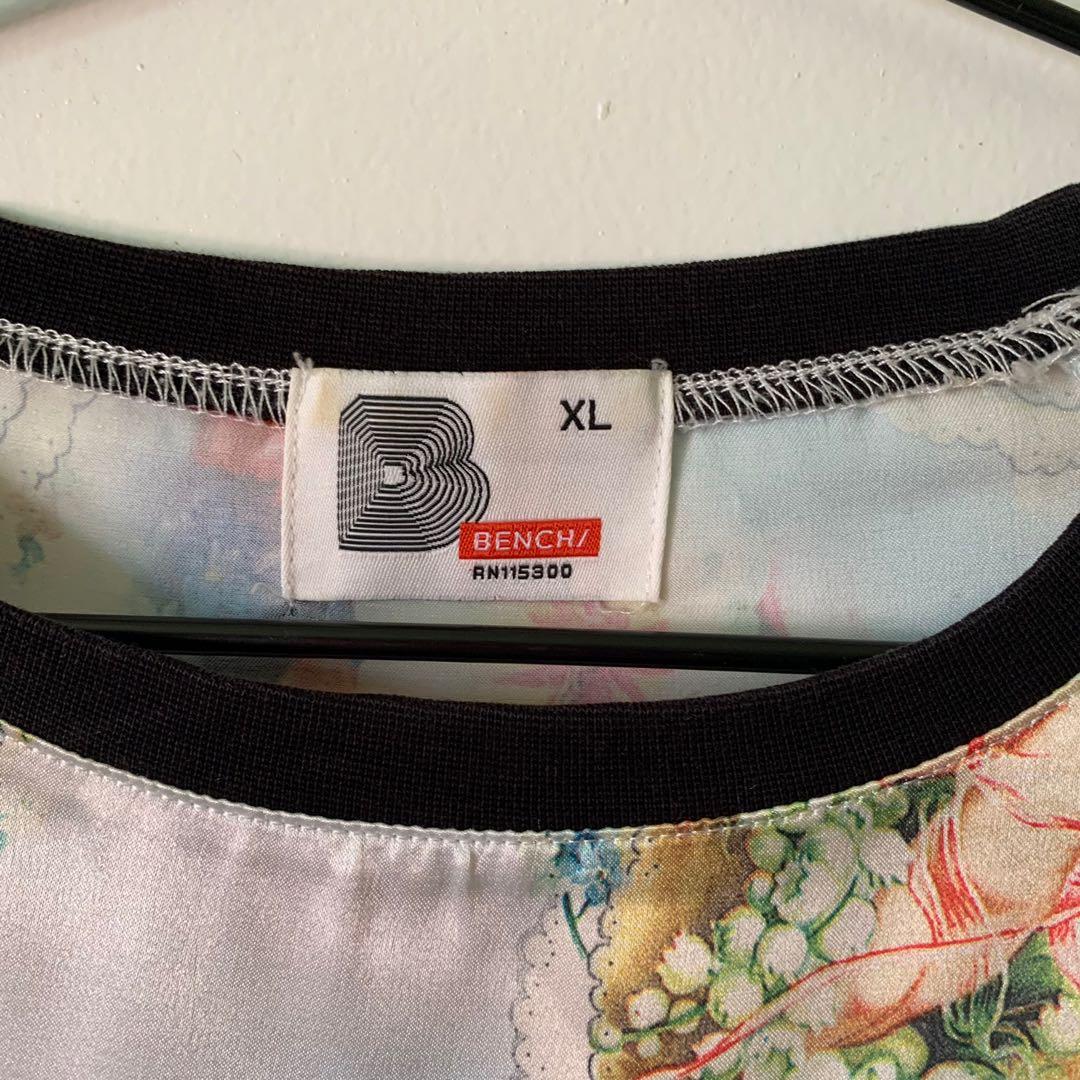 Bench Satin Printed T-Shirt (Category: Blouses) located in Mandaluyong City. Submitted by yeontsuki (Listing ID 1130290568, Image 2). Description: Overall printed cherub shirt! Satin so presko sya!.
